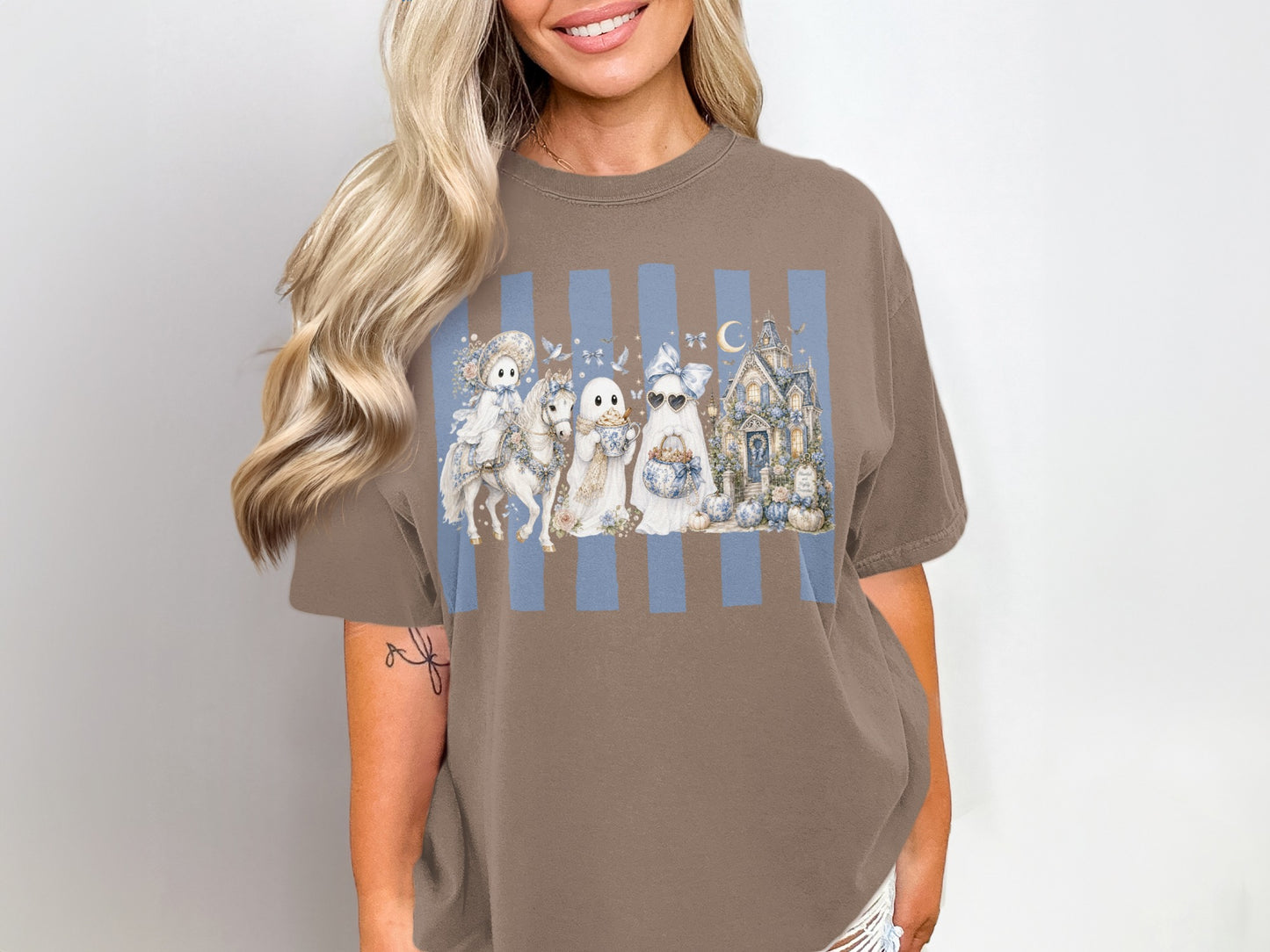 Ghost Halloween graphic on a taupe t-shirt with blue stripes and a haunted house.