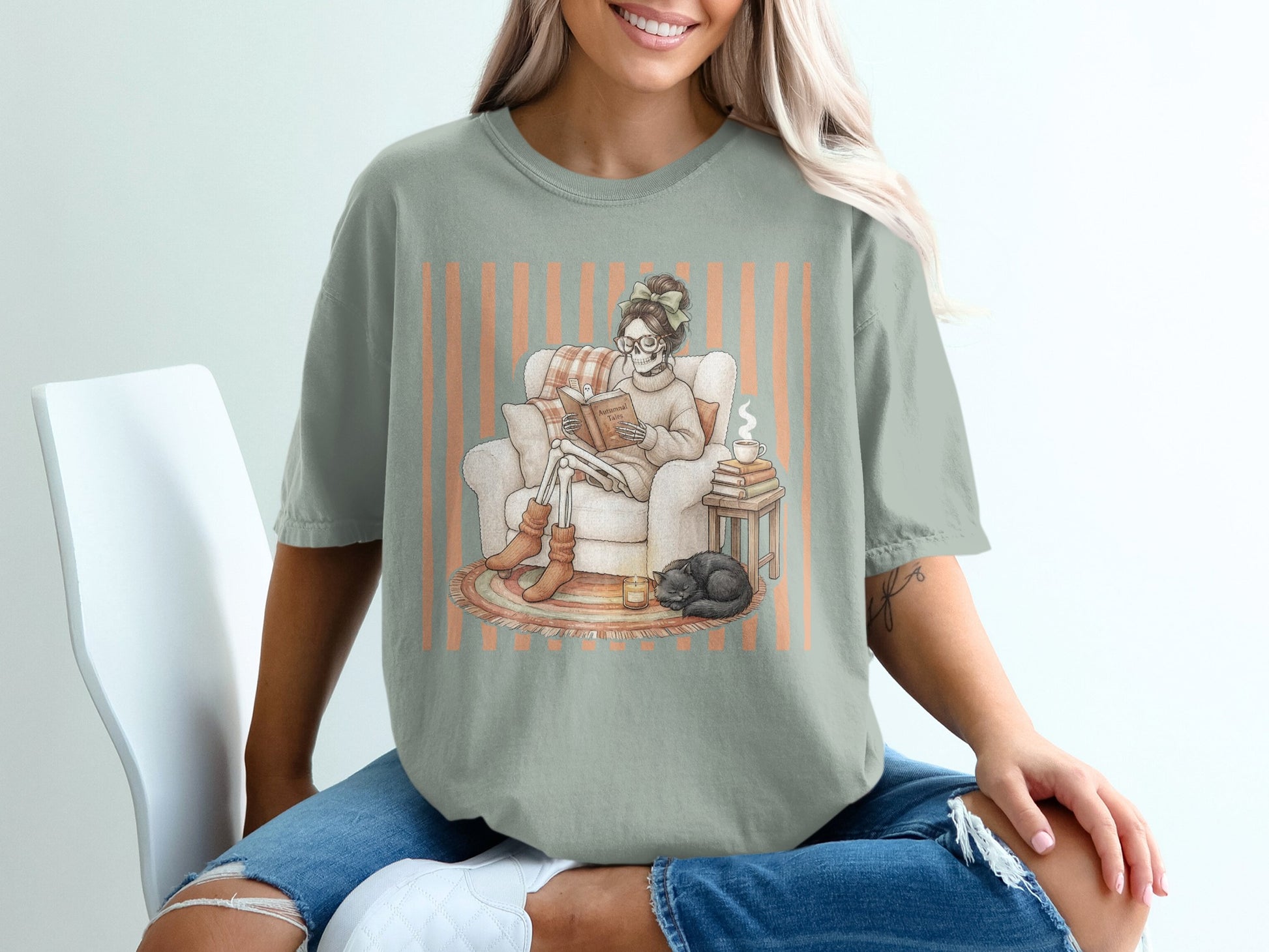 Skeleton reading book in armchair with cat, coffee, and floral striped background.