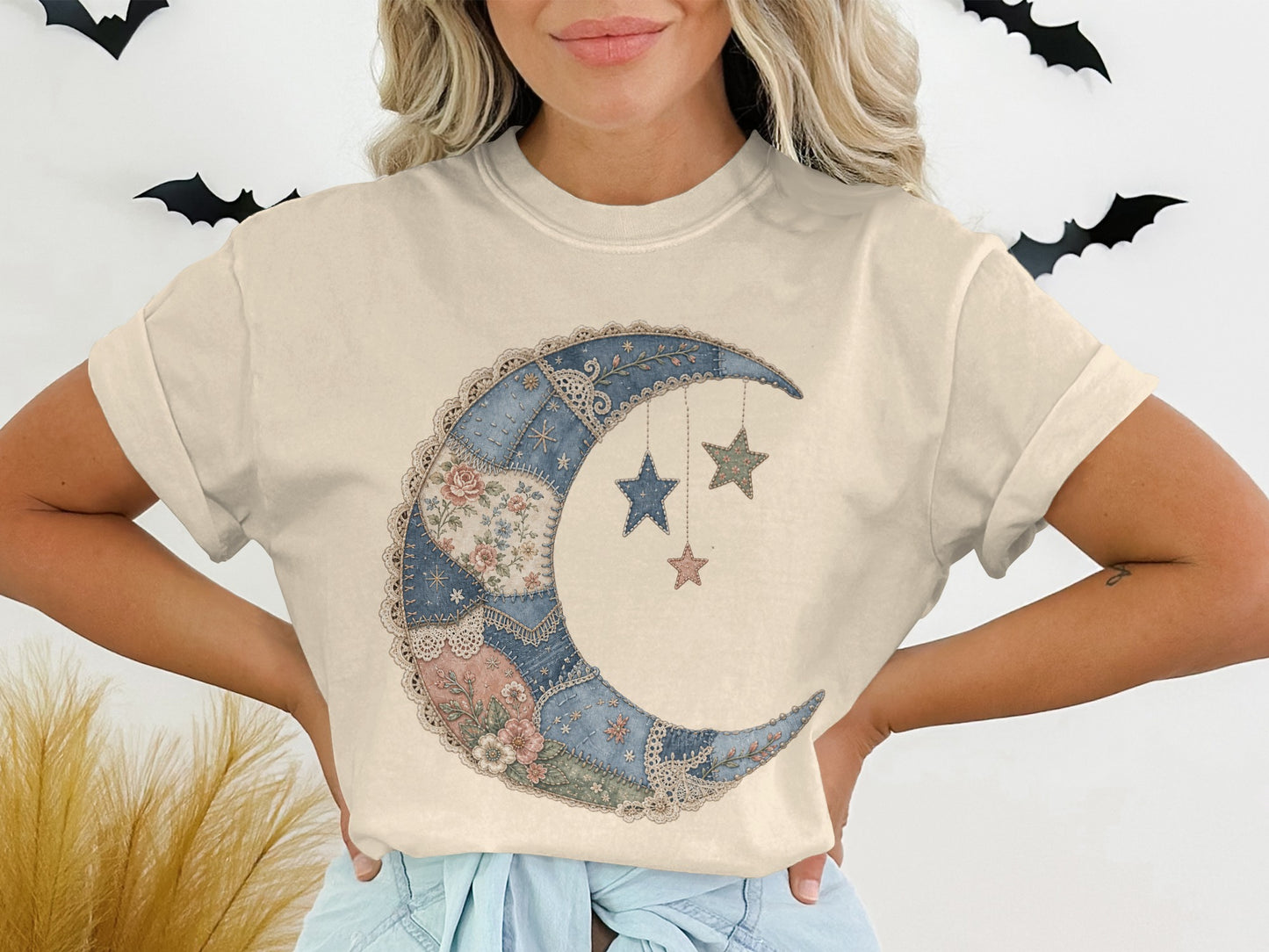 Cream t-shirt with crescent moon and stars graphic in quilted pattern.