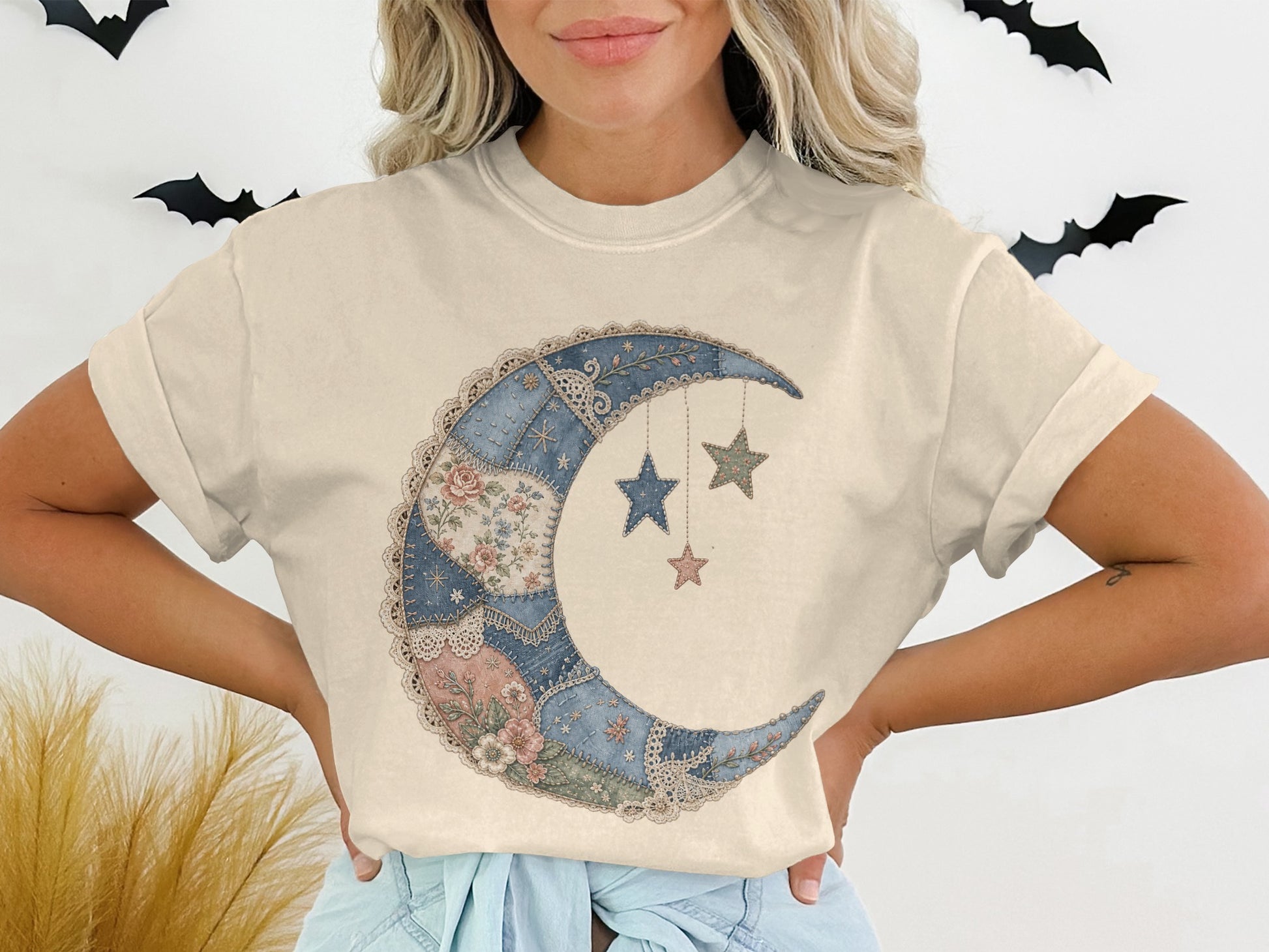Cream t-shirt with crescent moon and stars graphic in quilted pattern.