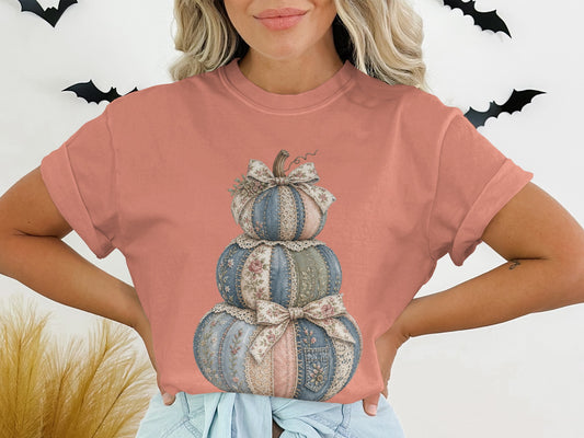 Layered pumpkins with floral patchwork and lace accents, tied with bows.