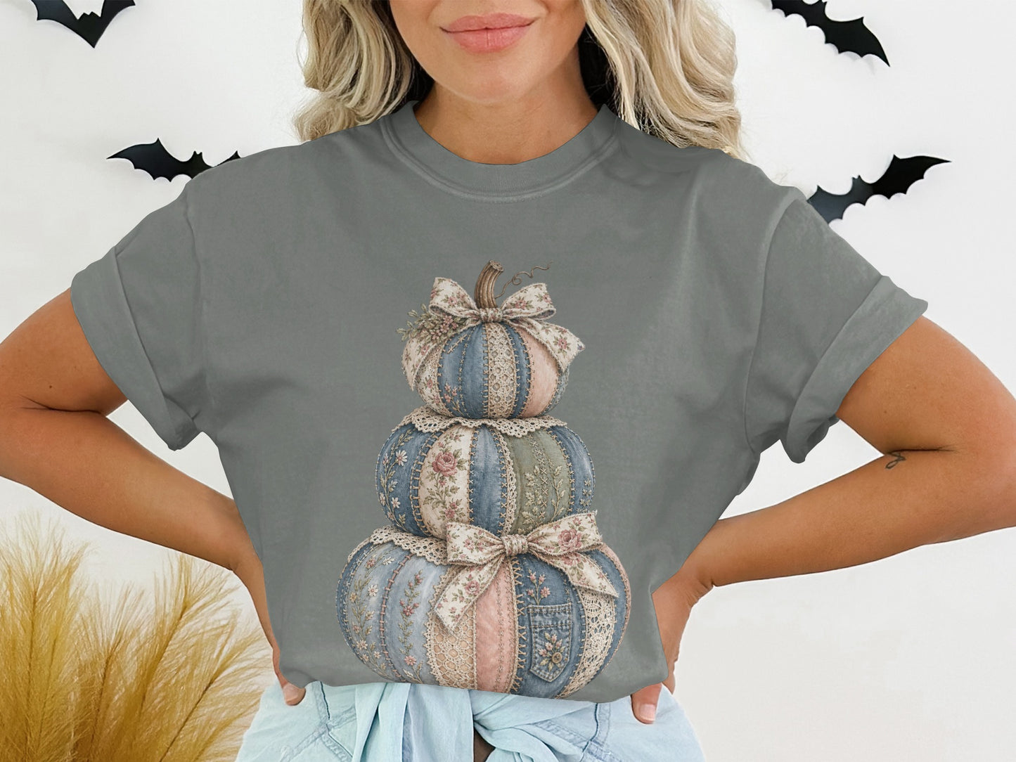 Gray t-shirt with stacked patchwork pumpkins in blue, pink, and cream fabric.