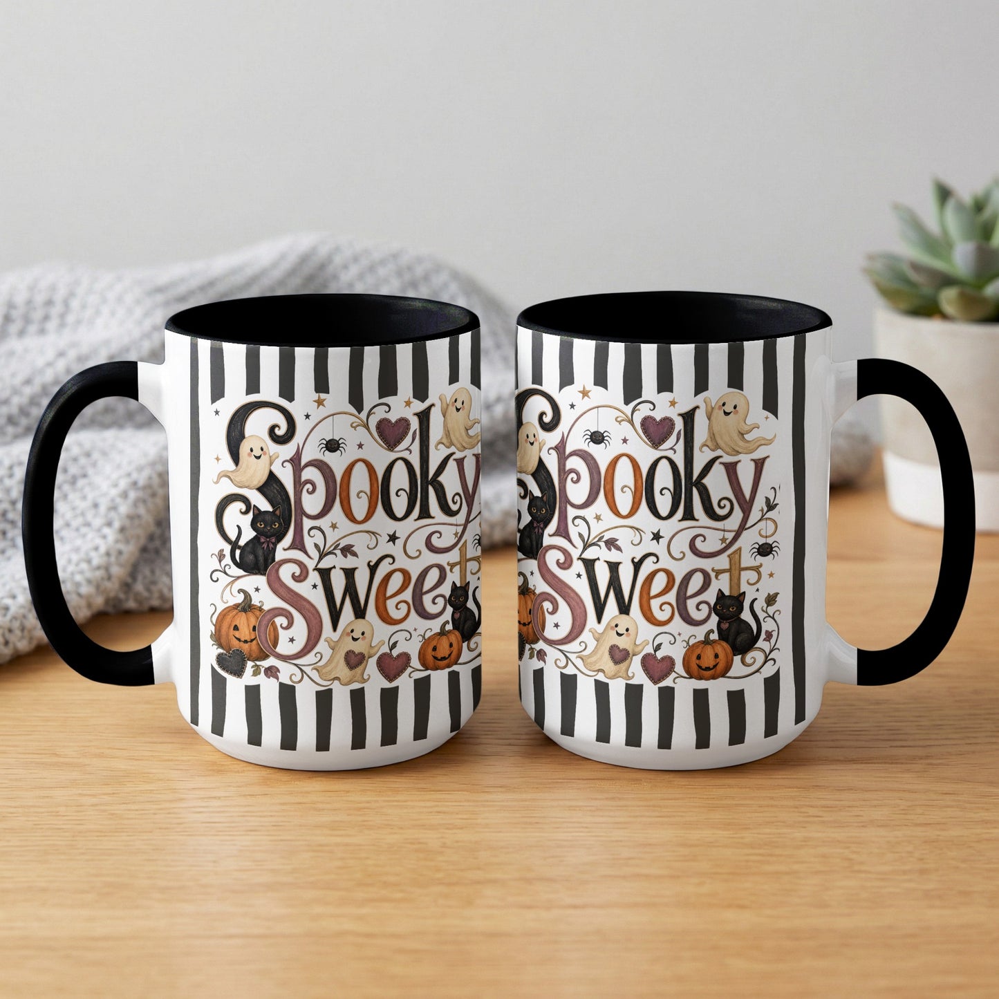 Two white mugs with black stripes and "Spooky Sweet" Halloween design featuring ghosts and cats.