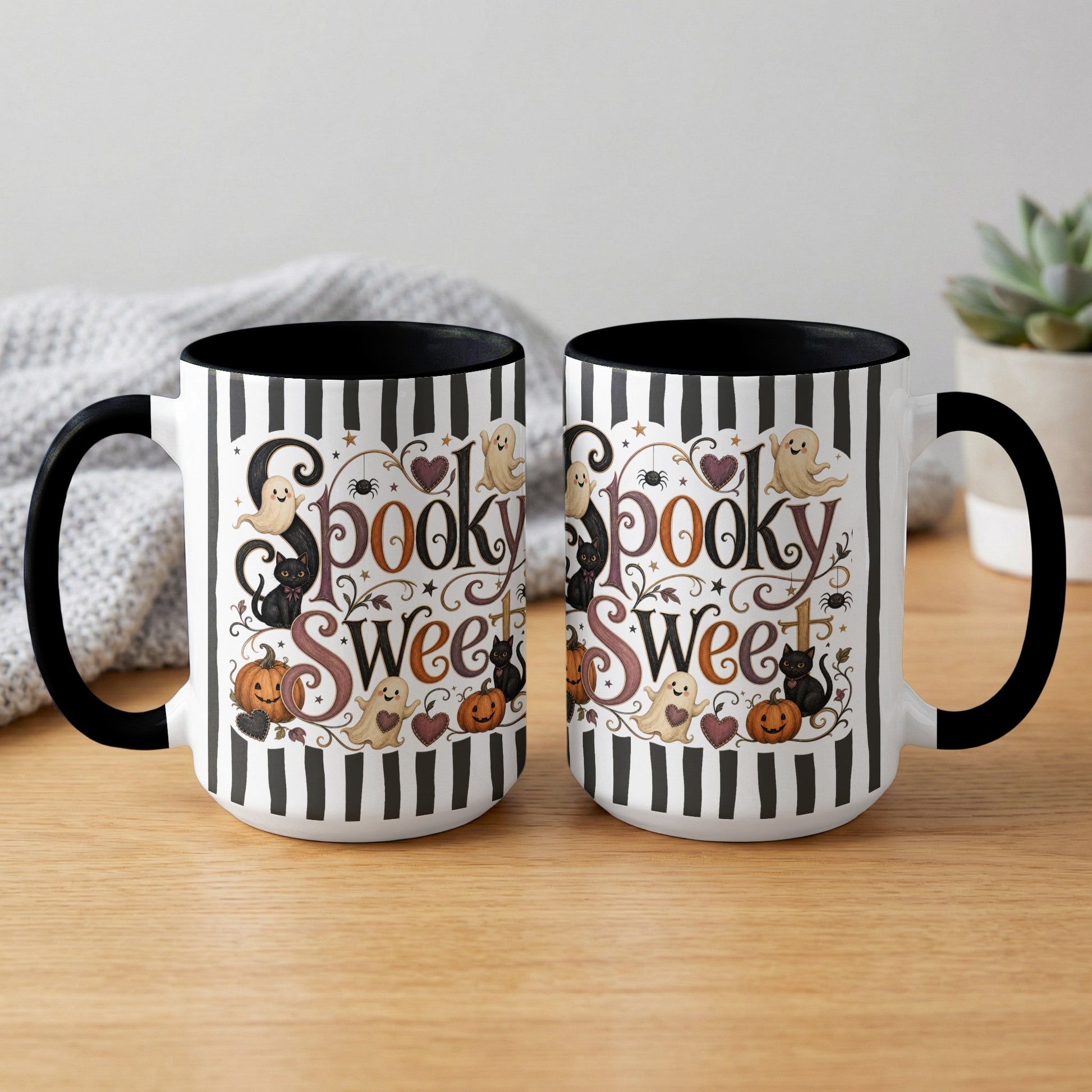 Two white mugs with black stripes and "Spooky Sweet" Halloween design featuring ghosts and cats.