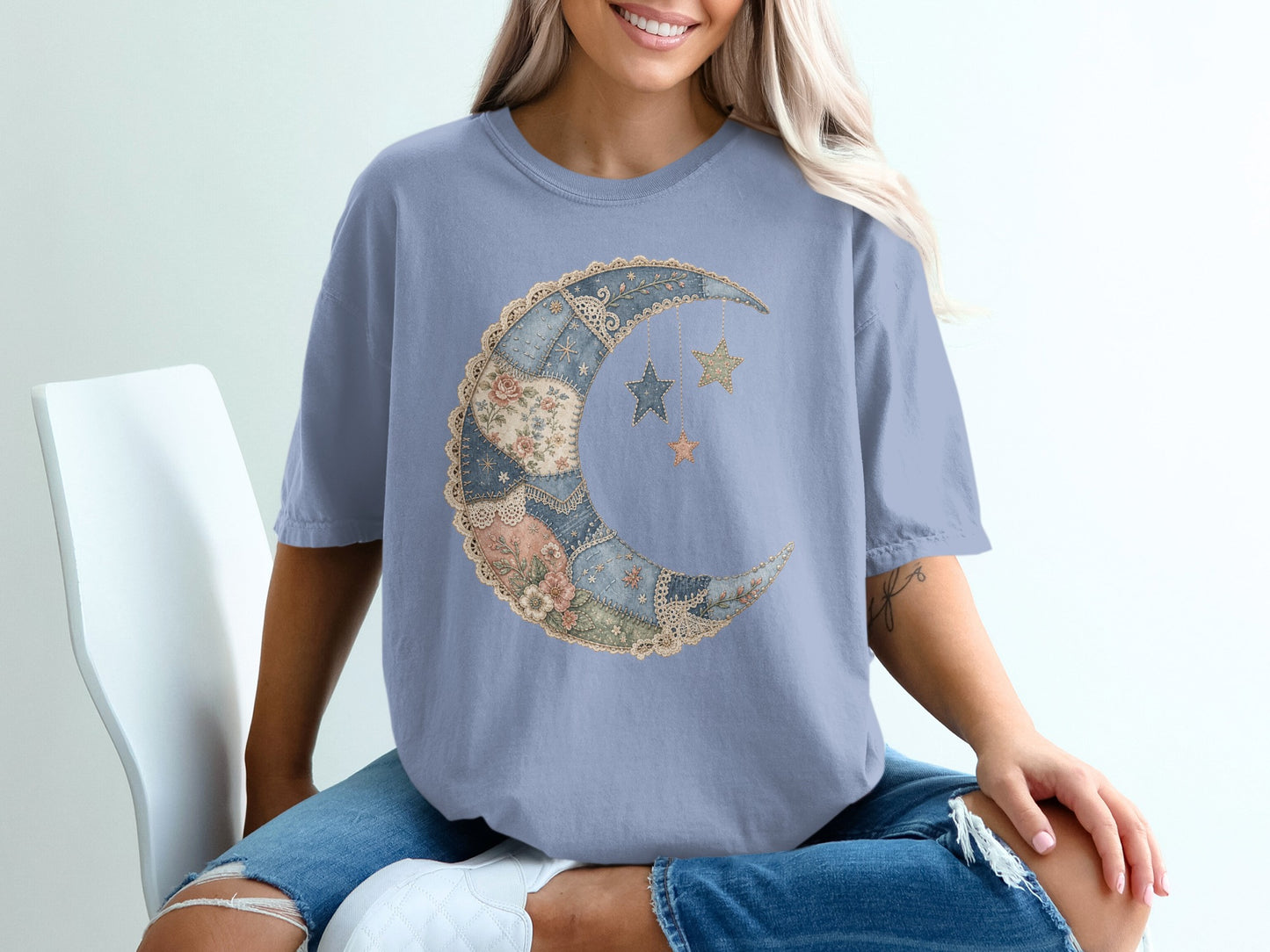 T-shirt with a crescent moon and star graphic, featuring patchwork and lace details.
