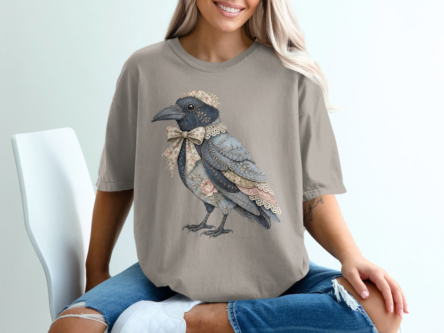 T-shirt with a vintage crow illustration wearing a floral bow and cap.