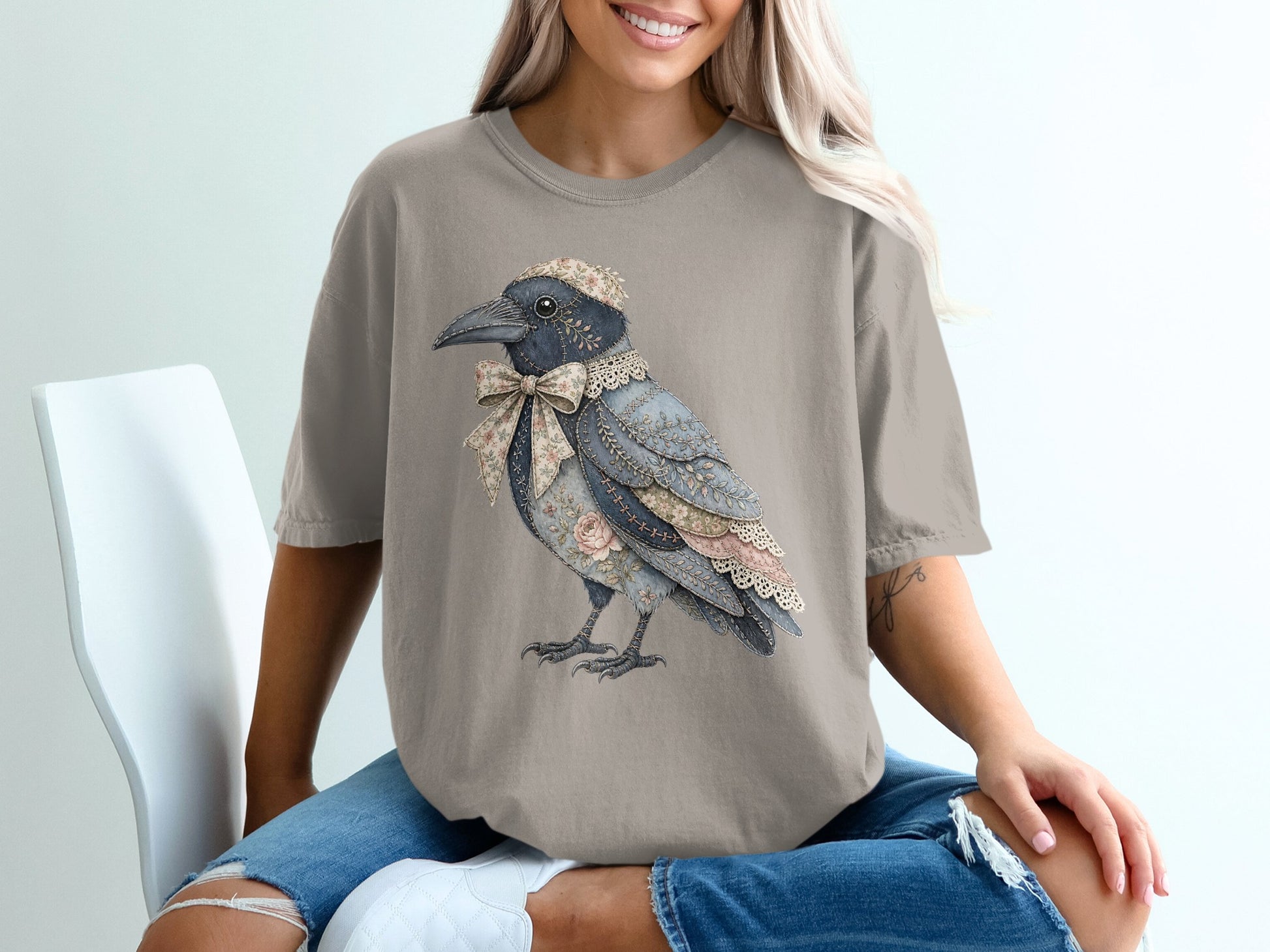 T-shirt with a vintage crow illustration wearing a floral bow and cap.