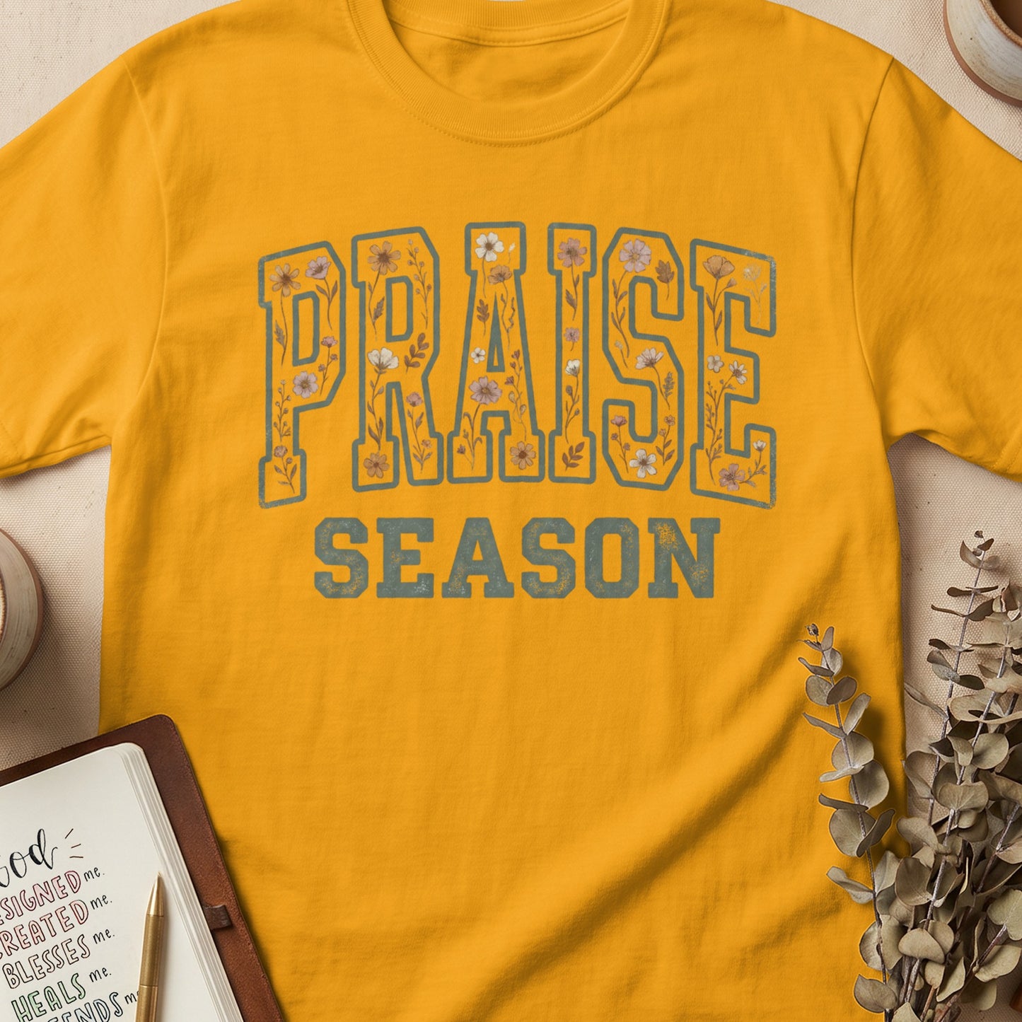 Yellow t-shirt with "PRAISE SEASON" text and floral accents.