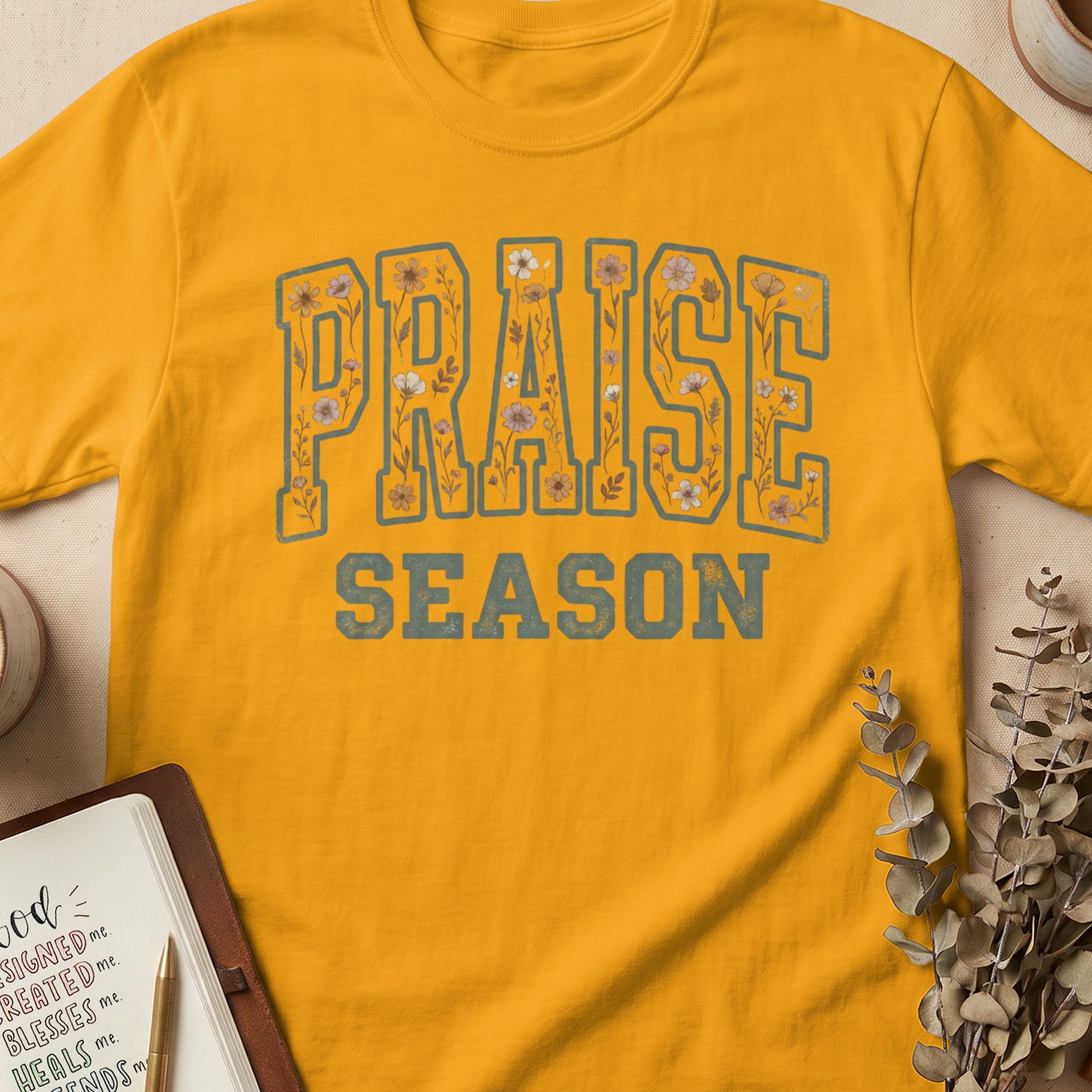 Yellow t-shirt with "PRAISE SEASON" text and floral accents.