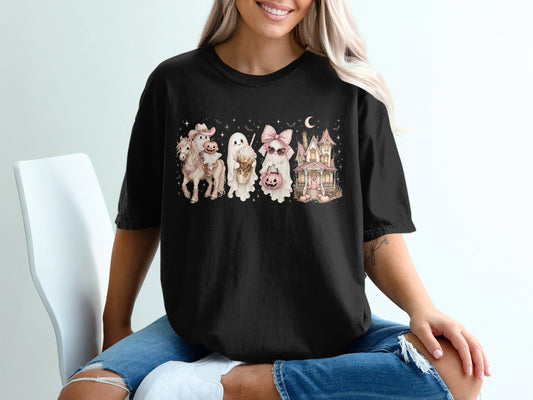 Black t-shirt with watercolor ghosts, horse, and haunted house Halloween graphic.
