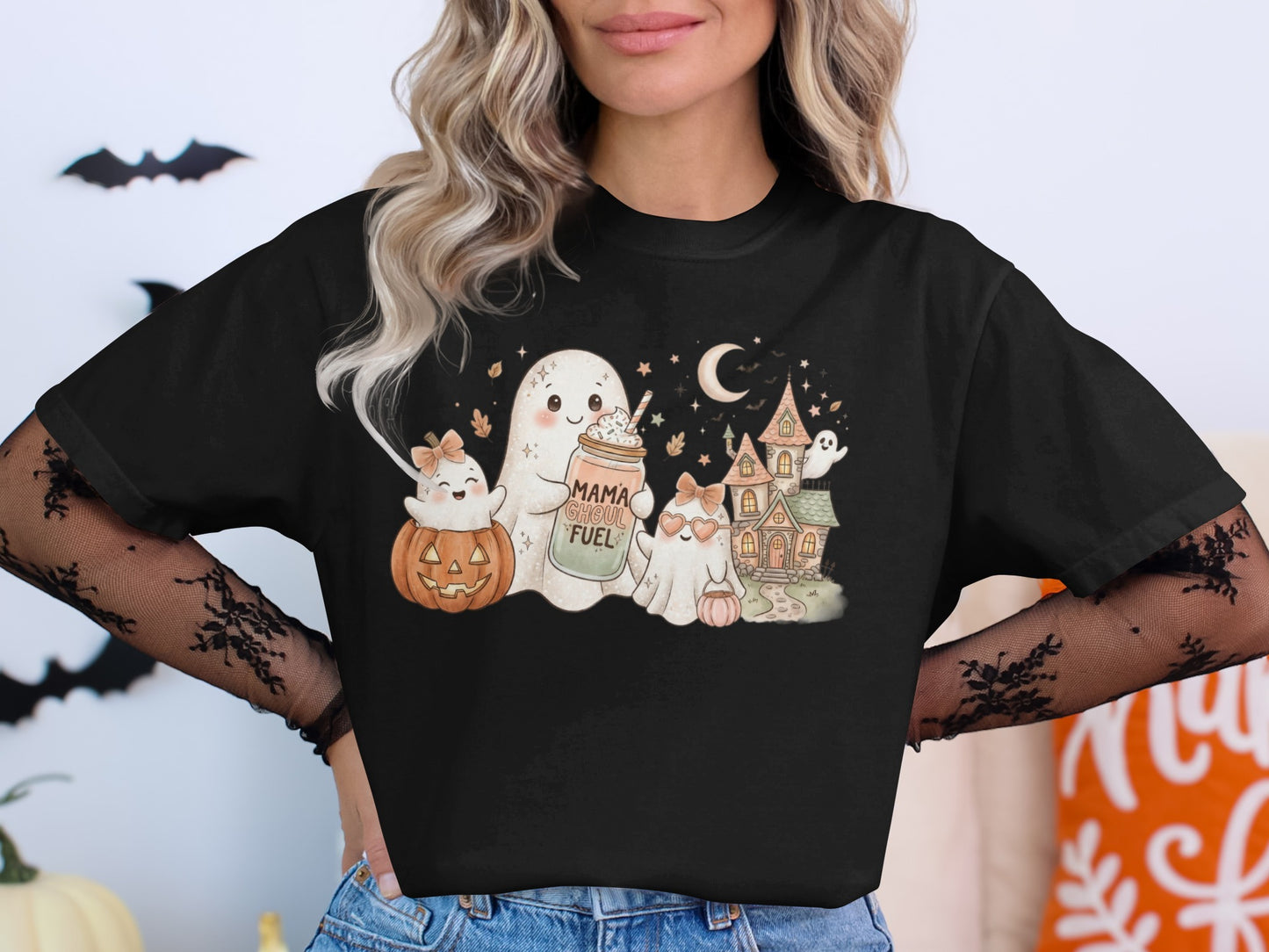 Cute ghosts and Halloween scene with text "Mama Ghoul Fuel" on shirt.