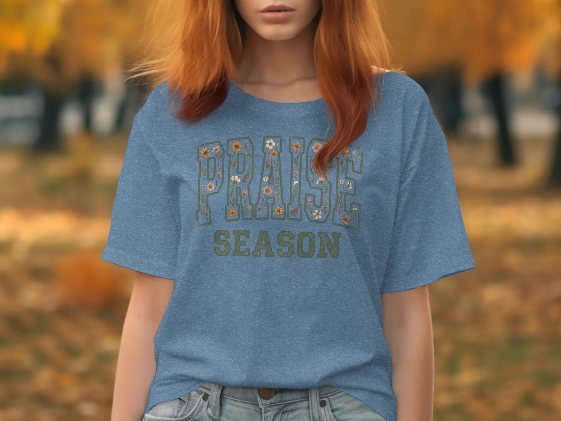 Blue t-shirt with "PRAISE SEASON" text featuring floral details.