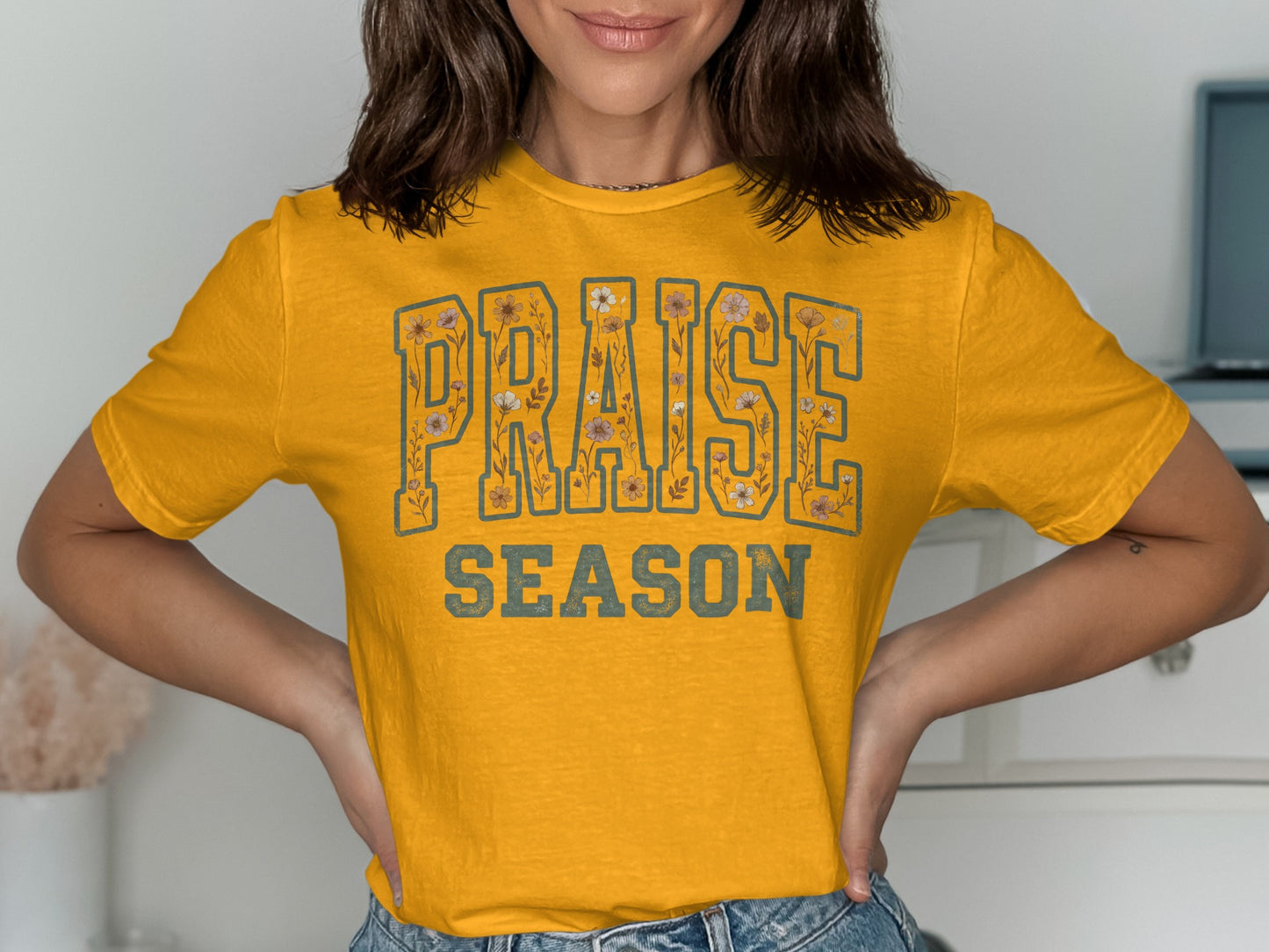 Yellow t-shirt with "PRAISE SEASON" text and floral details.
