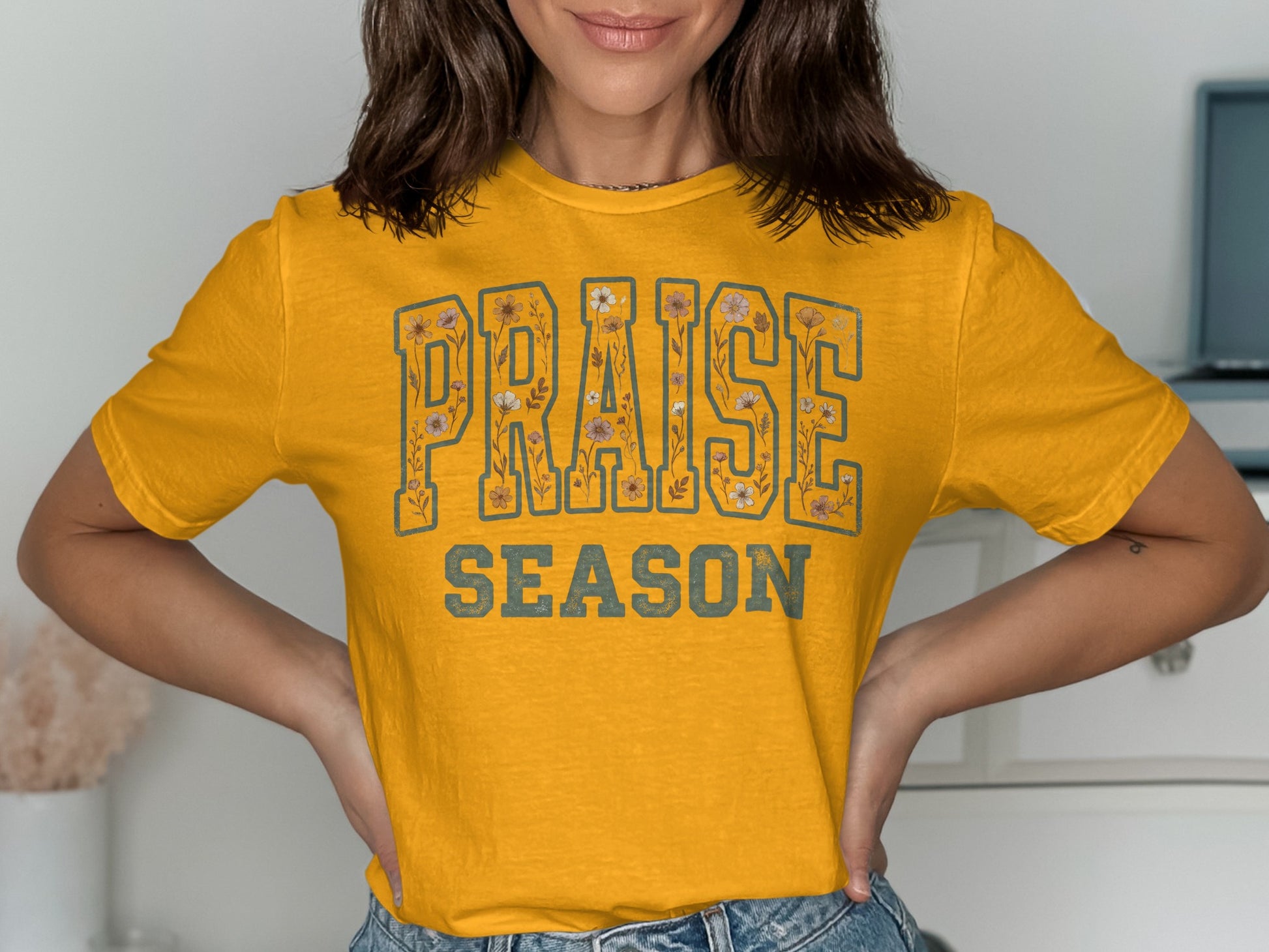 Yellow t-shirt with "PRAISE SEASON" text and floral details.
