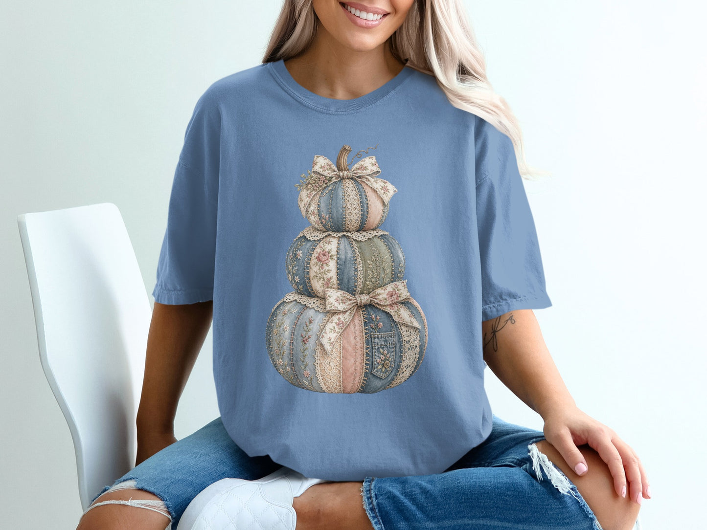 Blue t-shirt with a stacked pumpkin graphic featuring fabric textures and lace.