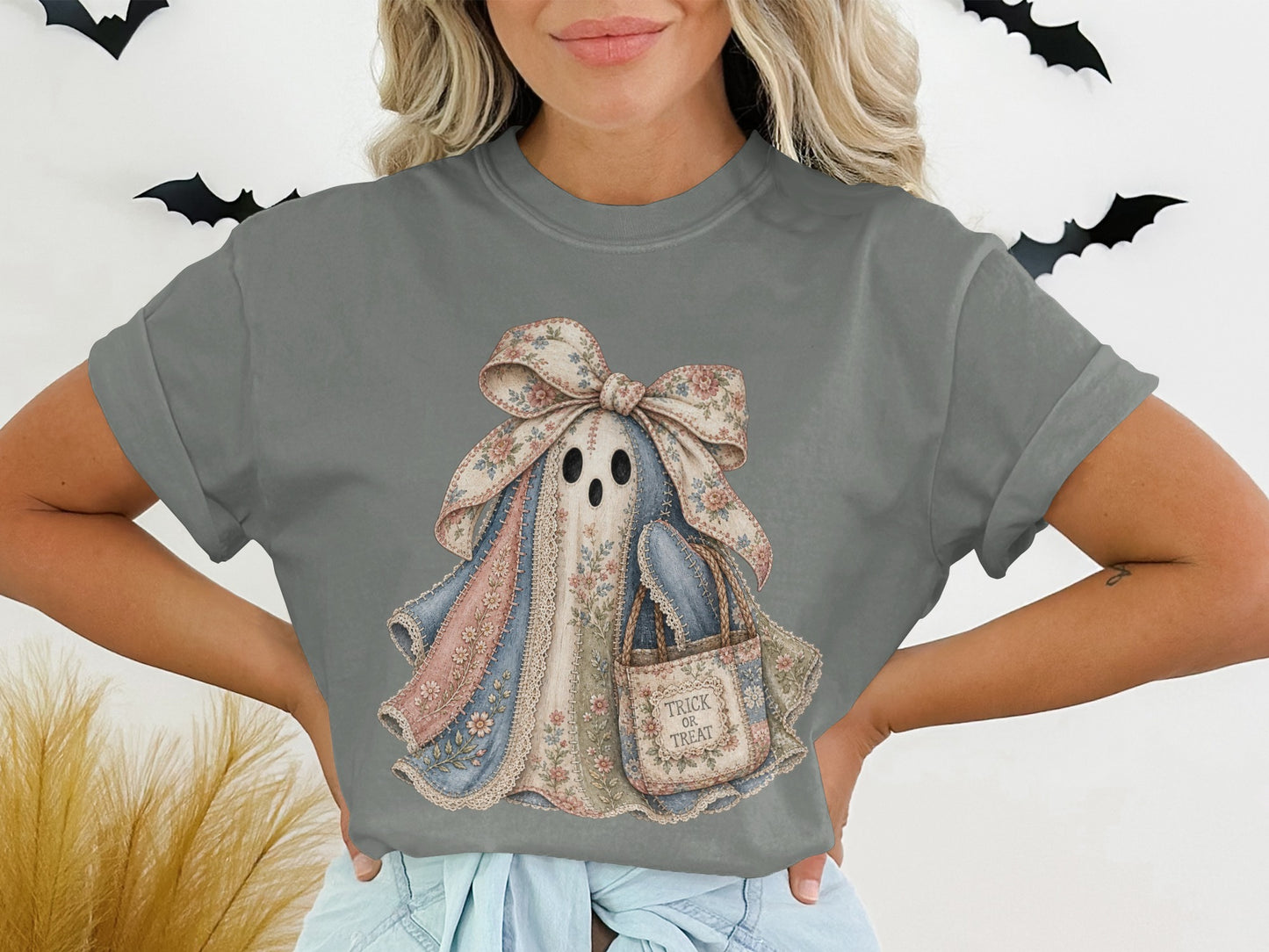 Ghost graphic with floral patches and "Trick or Treat" bag on gray t-shirt.