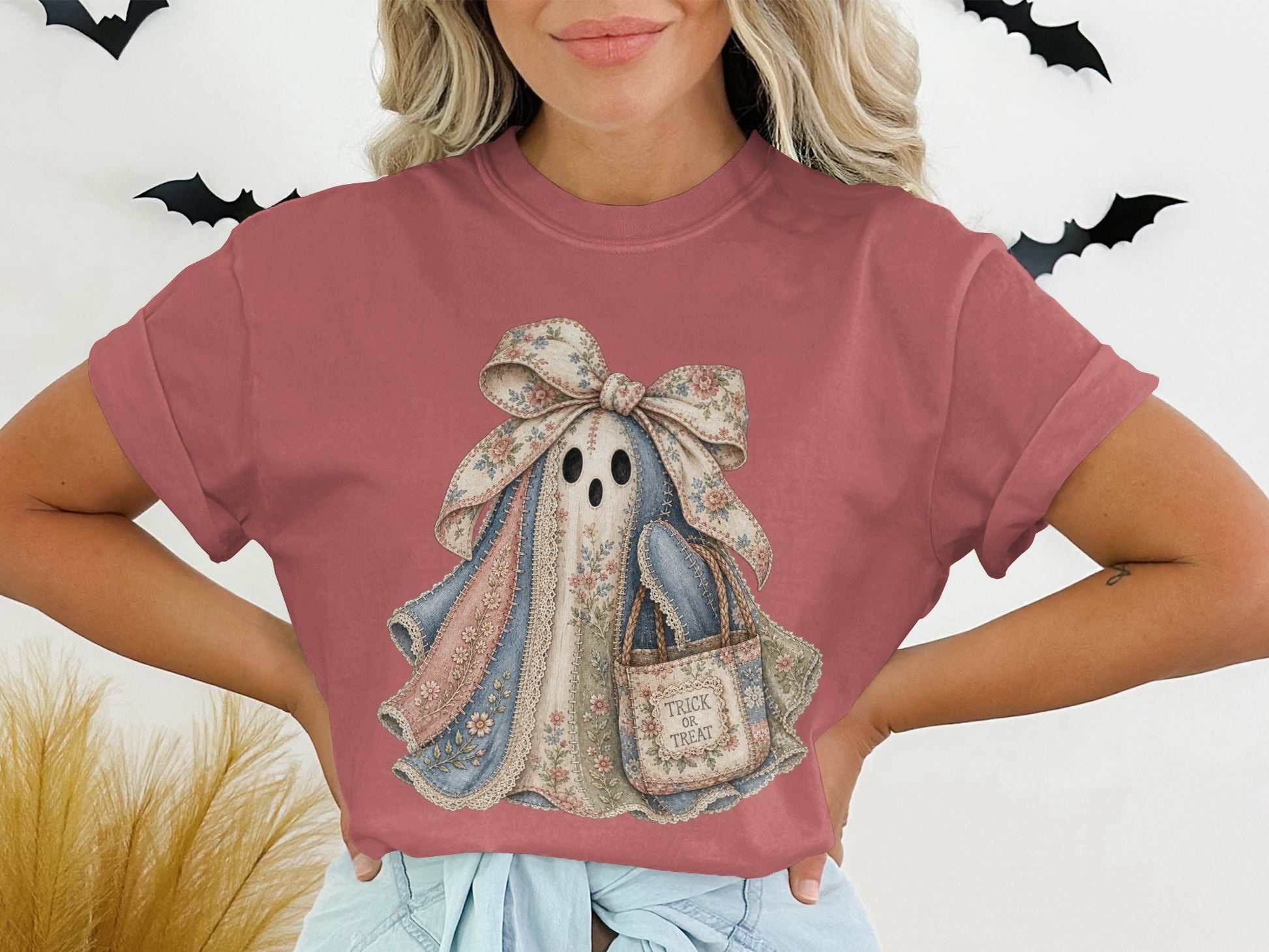 Ghost graphic t-shirt with floral pattern, a candy bag labeled "Trick or Treat."