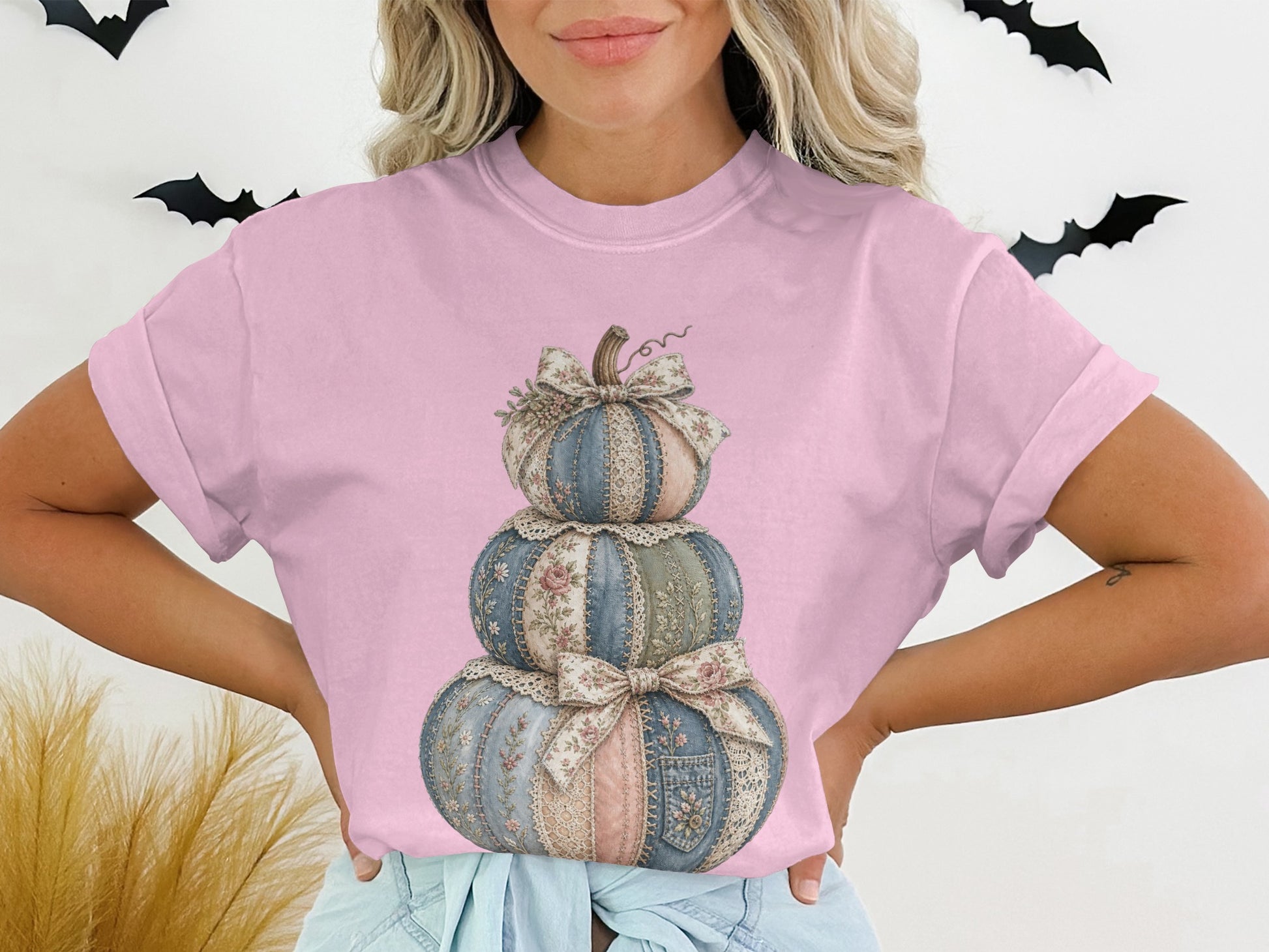 Stacked decorative pumpkins with floral and lace patches and bows.