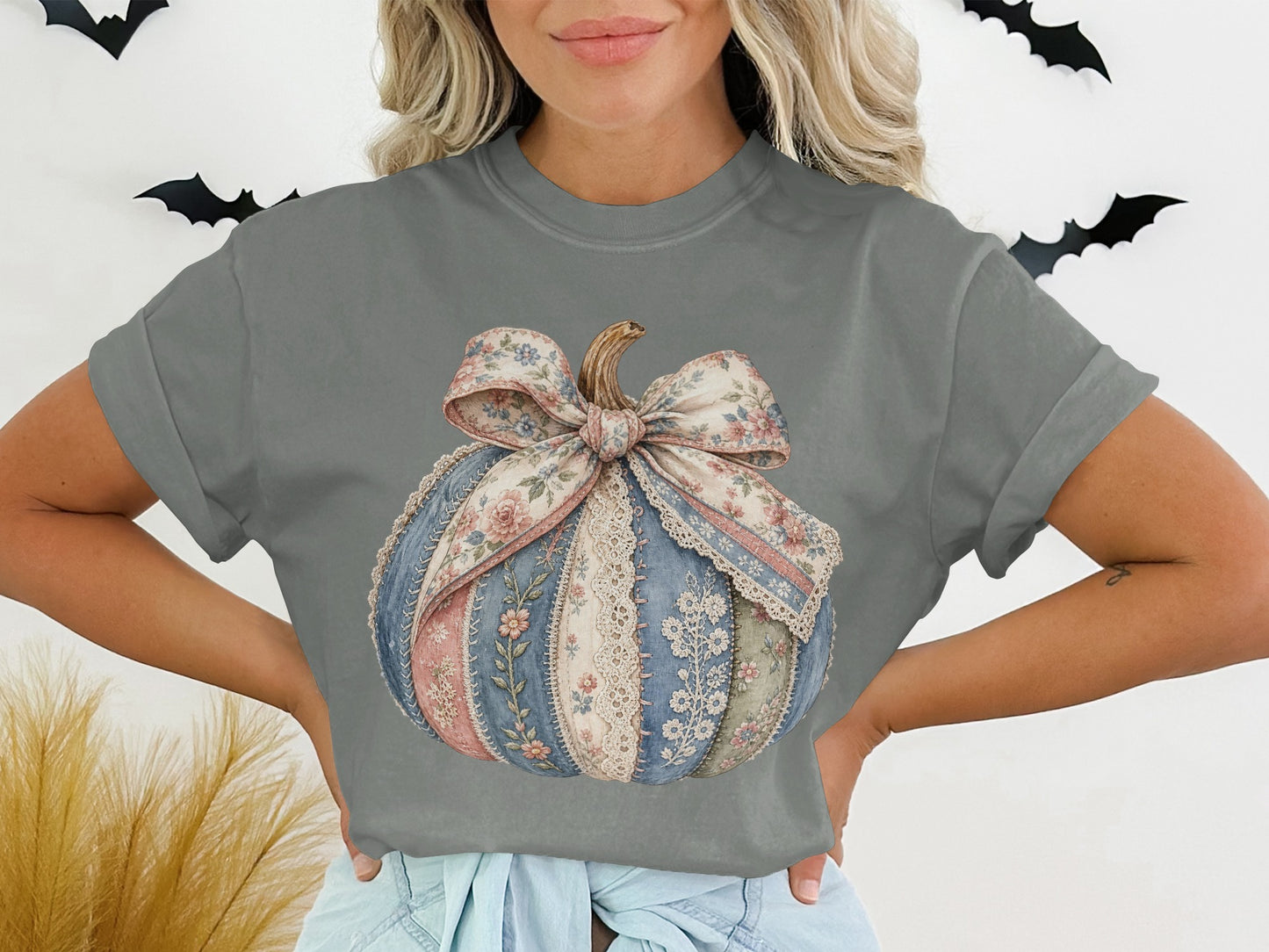 T-shirt with a patchwork pumpkin graphic featuring floral and lace patterns.