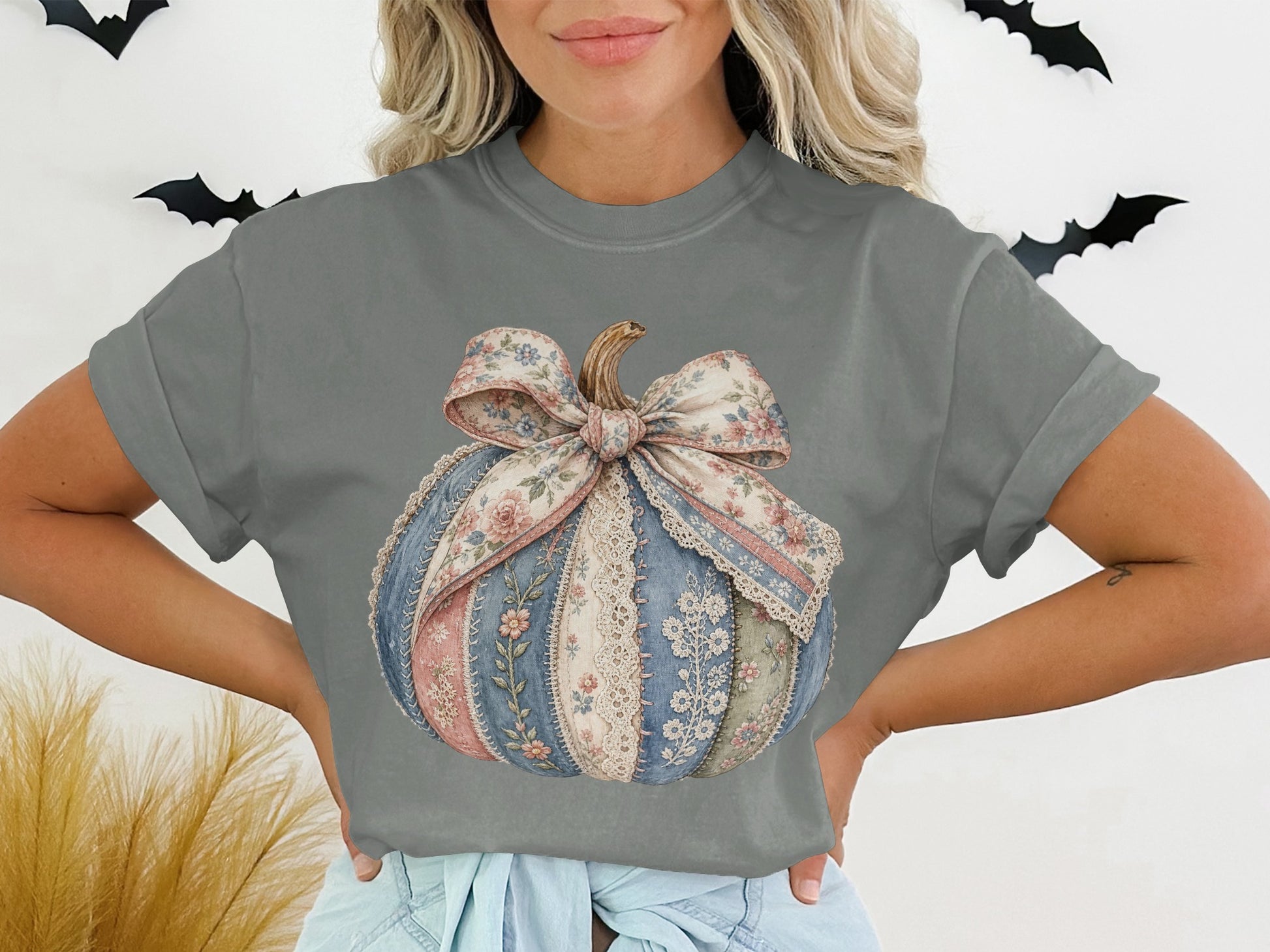 T-shirt with a patchwork pumpkin graphic featuring floral and lace patterns.