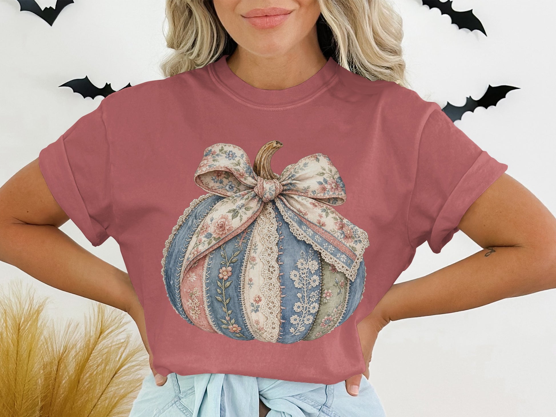 Rose pink t-shirt with a patchwork pumpkin graphic and bow.