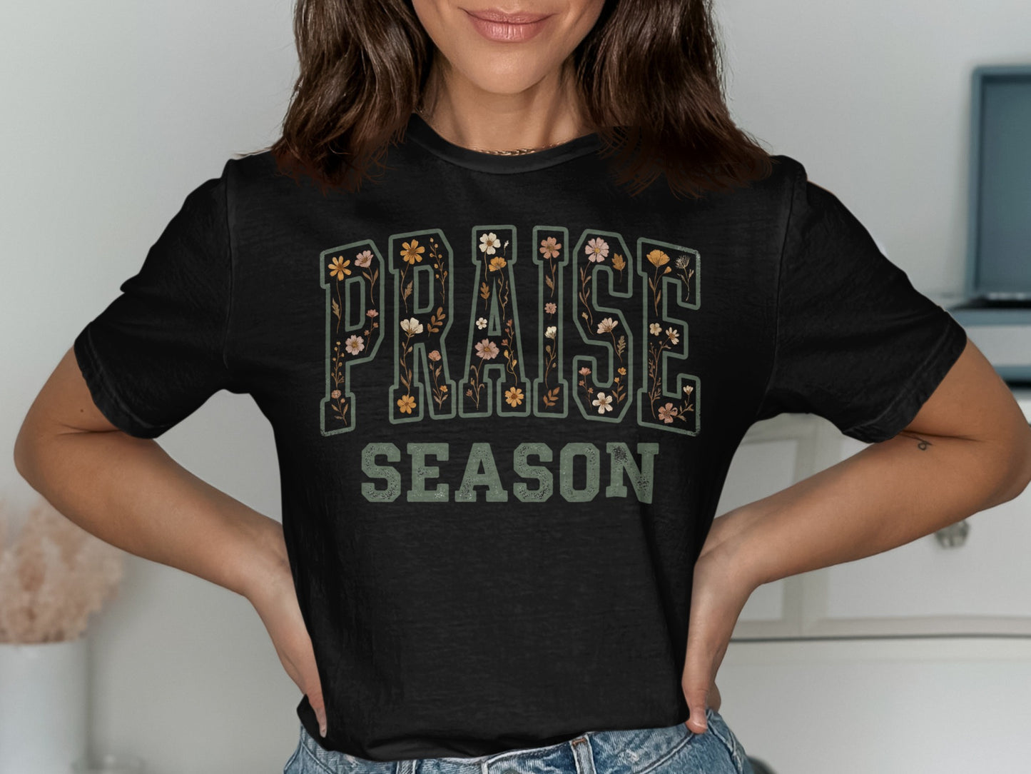Black t-shirt with "PRAISE SEASON" text decorated with flowers.
