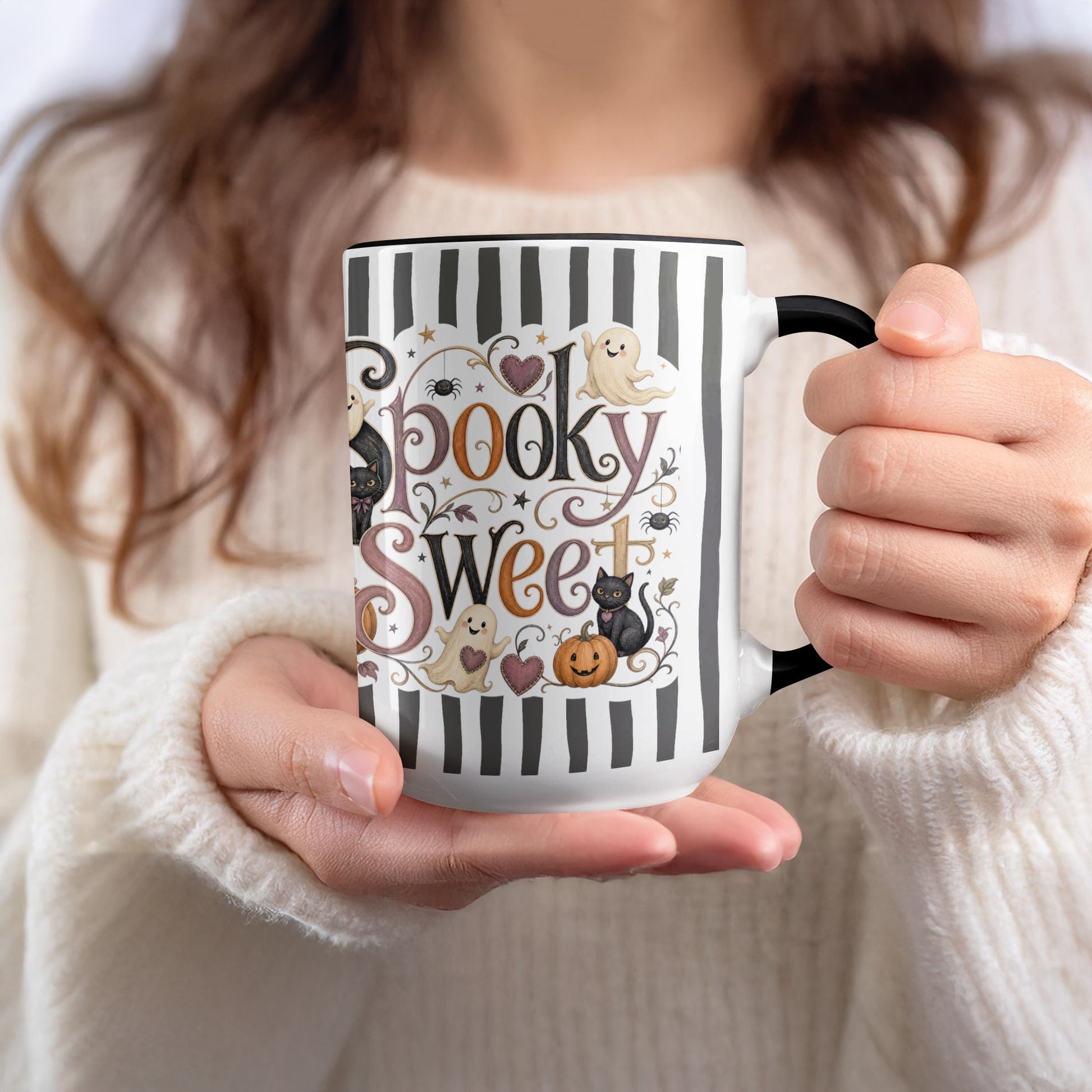 Mug with "Spooky Sweet" text, ghosts, black cats, pumpkin, and stripes.